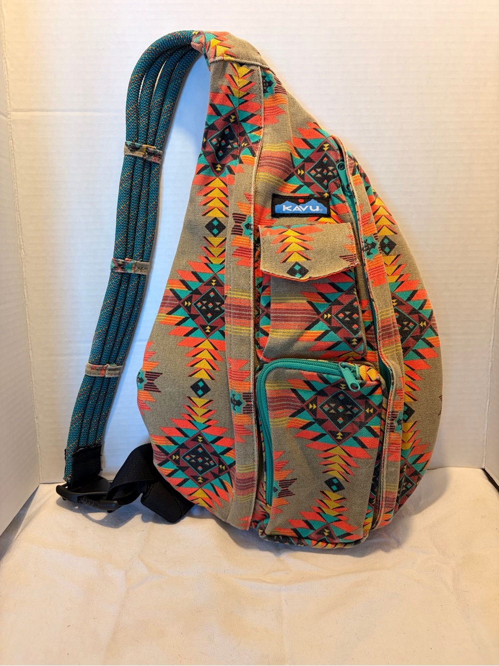 Kavu Sling Belt Bag in Tan with Teal and Orange Aztec Print